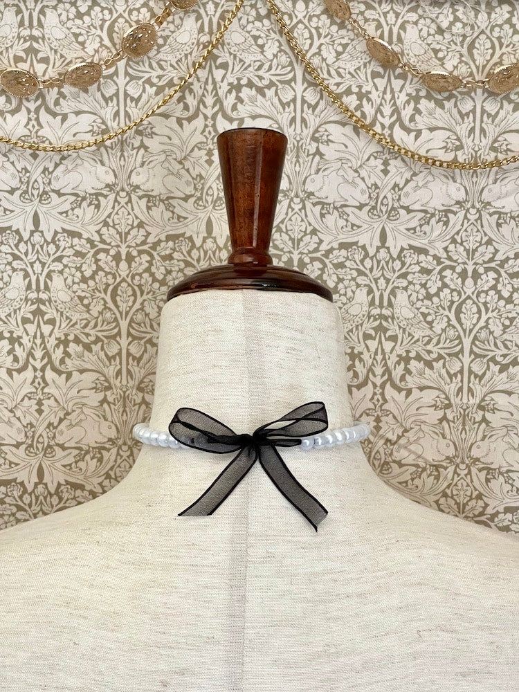 A handmade historically inspired victorian pearl beaded choker necklace in sheer black ribbon.