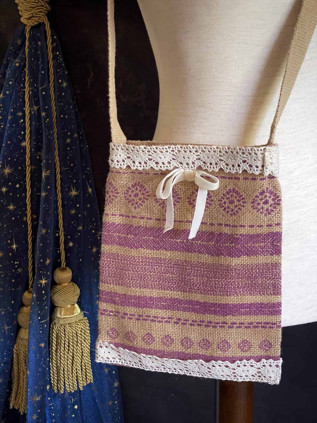 A cottagecore folk print historically inspired vintage style Handmade Lace-Trimmed Burlap Crossbody Bag in Lilac x Ivory