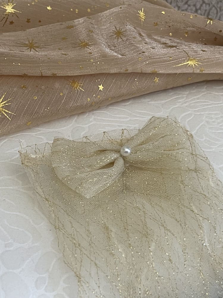 A Pair of Historically Inspired Sheer Lace Gloves with Bow Detail in Champagne Gold. Renaissance, regency, rococo, Victorian era gloves.