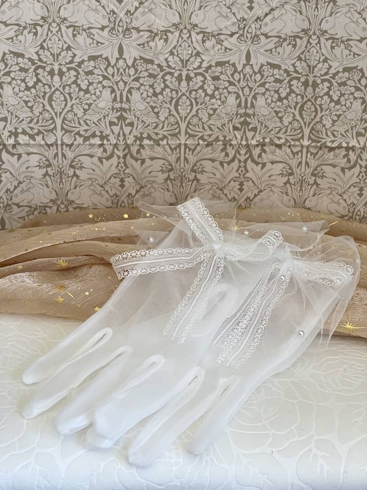 A Pair of Historically Inspired Sheer Gloves with Lace Bow Detail in White, with pearl accents. Perfect for regency, rococo, Victorian, and Edwardian eras.