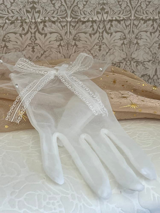 A Pair of Historically Inspired Sheer Gloves with Lace Bow Detail in White, with pearl accents. Perfect for regency, rococo, Victorian, and Edwardian eras.