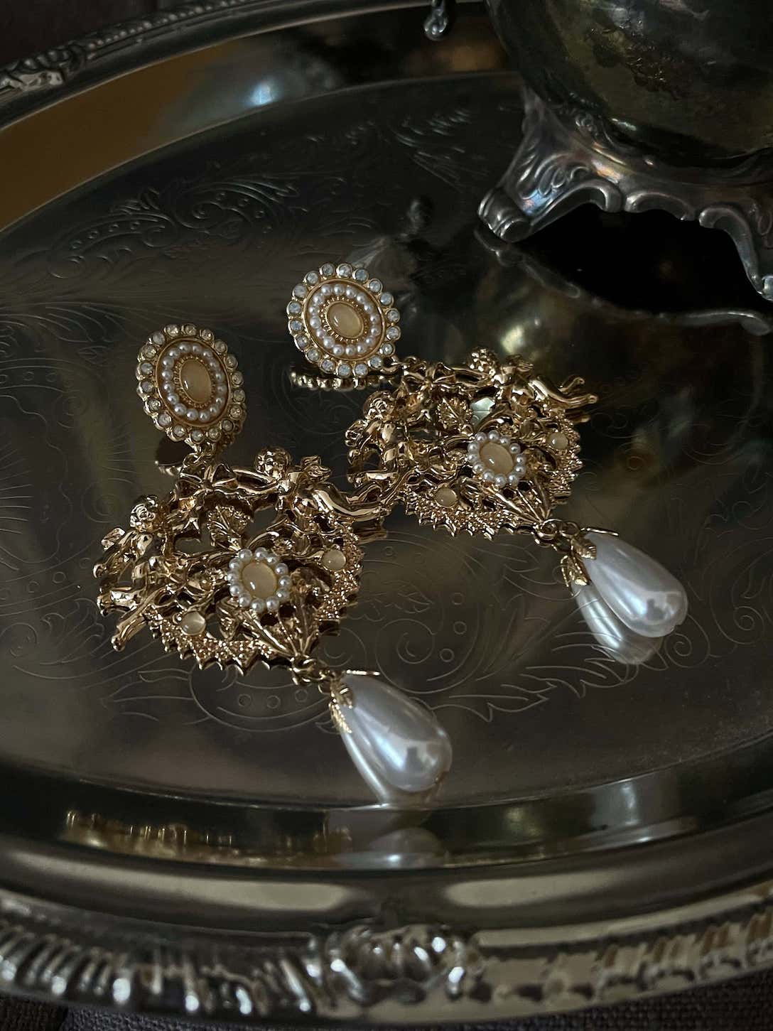 Historically inspired art history Renaissance Baroque Rococo angel sculpture filigree dangle earrings with pearl accents, clip on and regular, in gold.