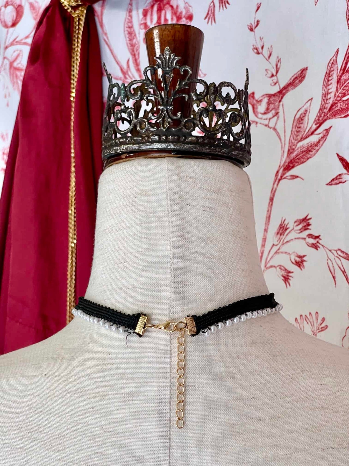 A Handmade Historically Inspired Pearl Lace Choker Necklace in Gothic Black with red rosette applique.
