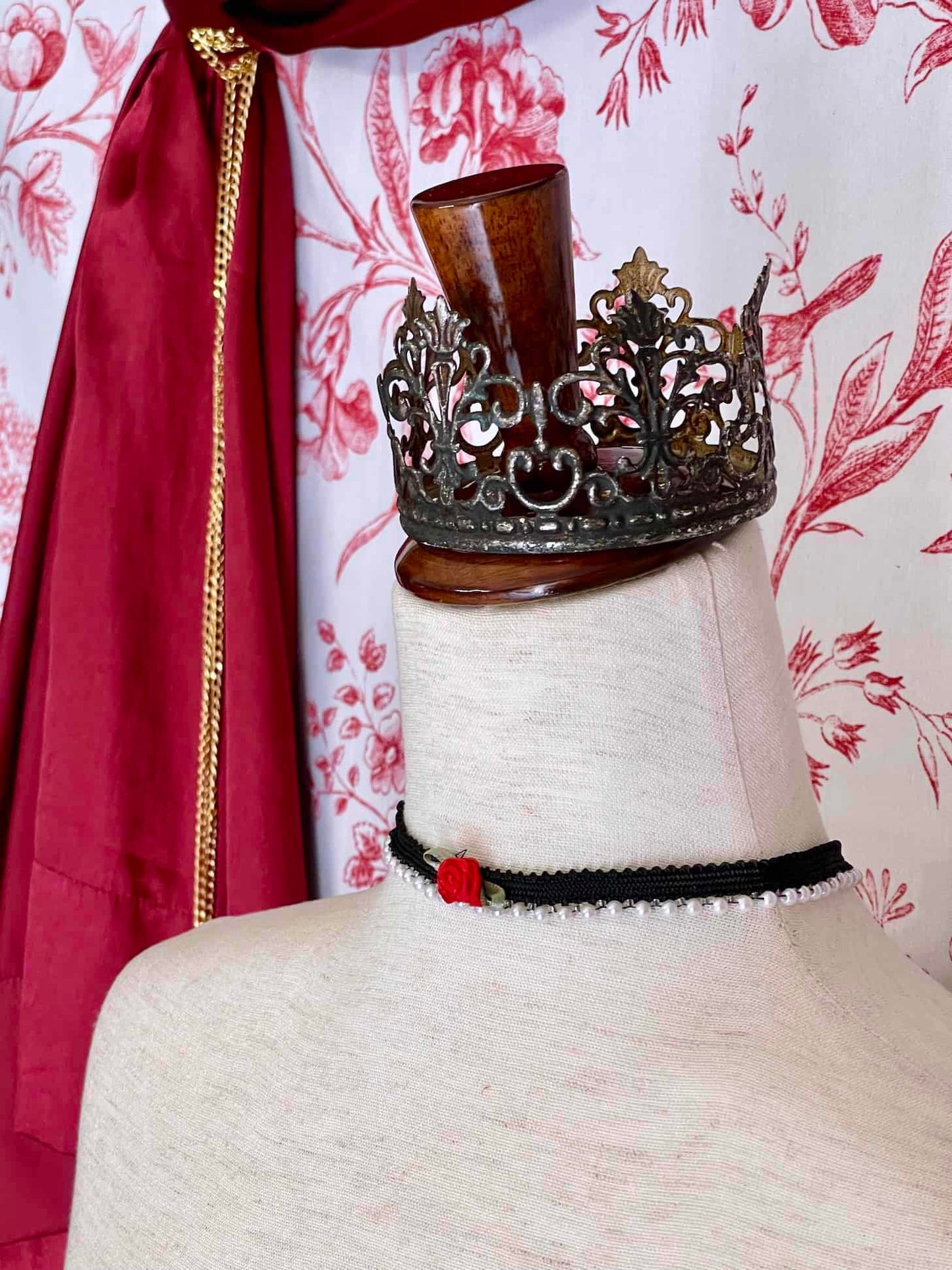 A Handmade Historically Inspired Pearl Lace Choker Necklace in Gothic Black with red rosette applique.