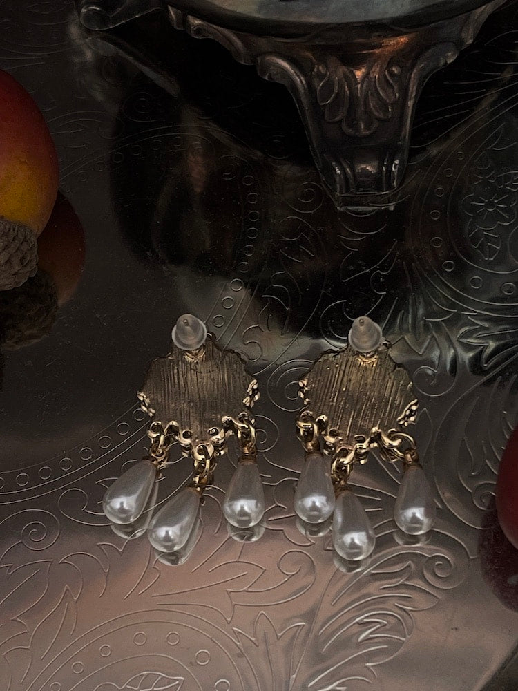 Historically inspired regency earrings with bee cameo, in white and gold, daphne bridgerton accessories on an antique dish.