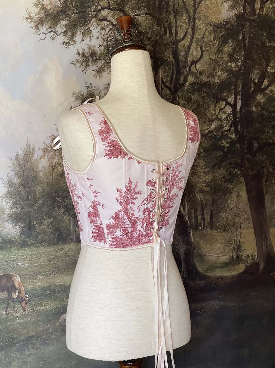 A Historically inspired pair of Baroque & Rococo Era Ivory and Red Countryside Toile de juoy Corset Stays.