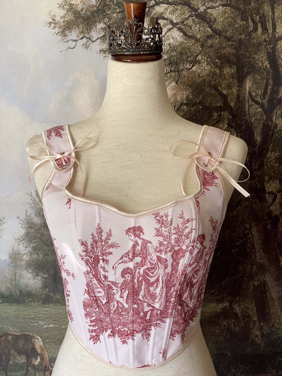 A Historically inspired pair of Baroque & Rococo Era Ivory and Red Countryside Toile de juoy Corset Stays.