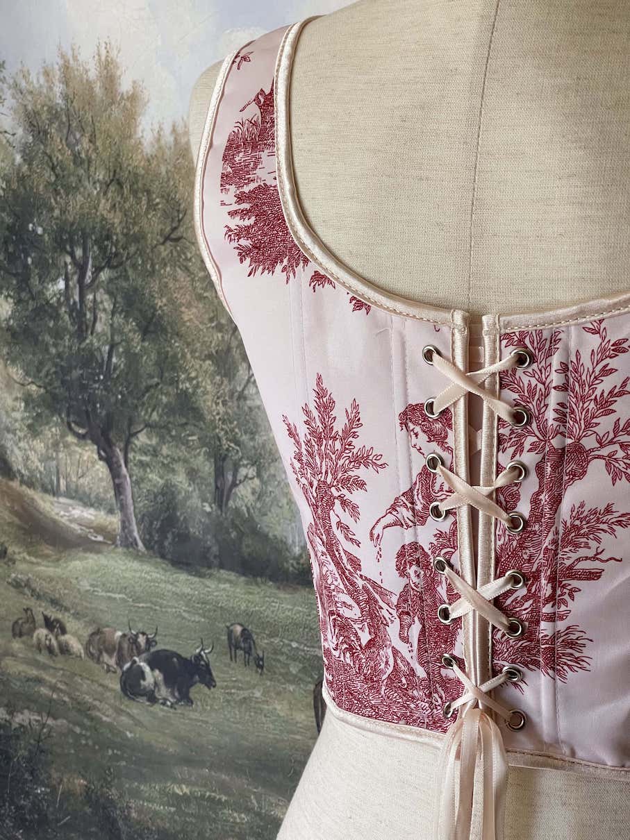 A Historically inspired pair of Baroque & Rococo Era Ivory and Red Countryside Toile de juoy Corset Stays.
