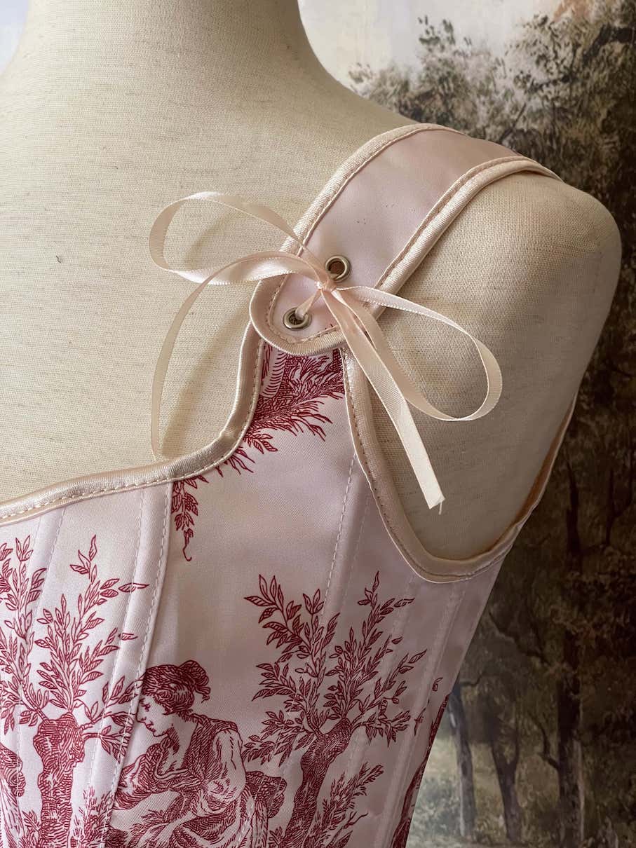 A Historically inspired pair of Baroque & Rococo Era Ivory and Red Countryside Toile de juoy Corset Stays.
