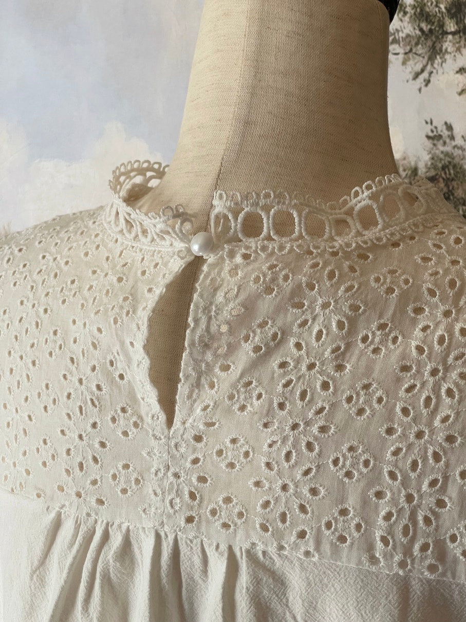A Historically inspired edwardian style short sleeve blouse with eyelet lace yoke and scalloped lace collar.