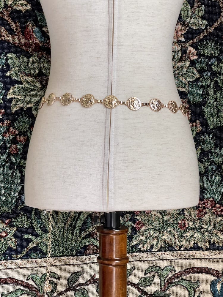 A Historically Inspired Renaissance and Medieval Classical Cameo Coin Belt in Gold on a mannequin.