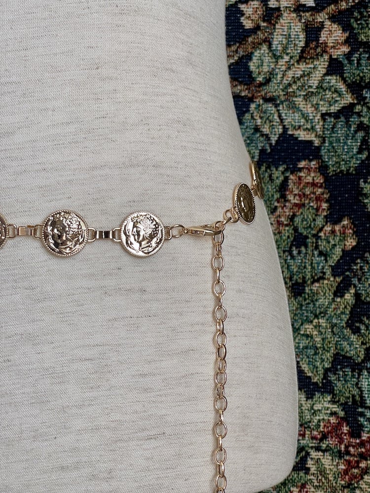 A Historically Inspired Renaissance and Medieval Classical Cameo Coin Belt in Gold on a mannequin.