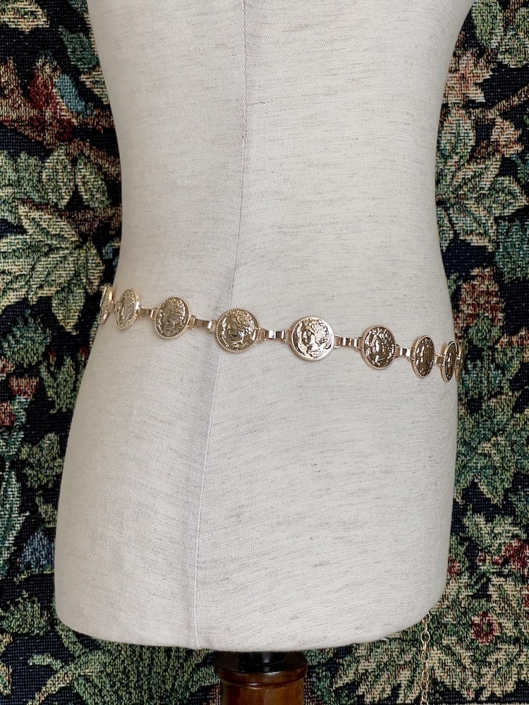 A Historically Inspired Renaissance and Medieval Classical Cameo Coin Belt in Gold on a mannequin.