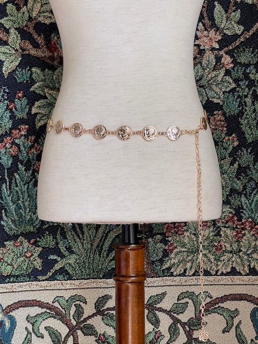A Historically Inspired Renaissance and Medieval Classical Cameo Coin Belt in Gold on a mannequin.