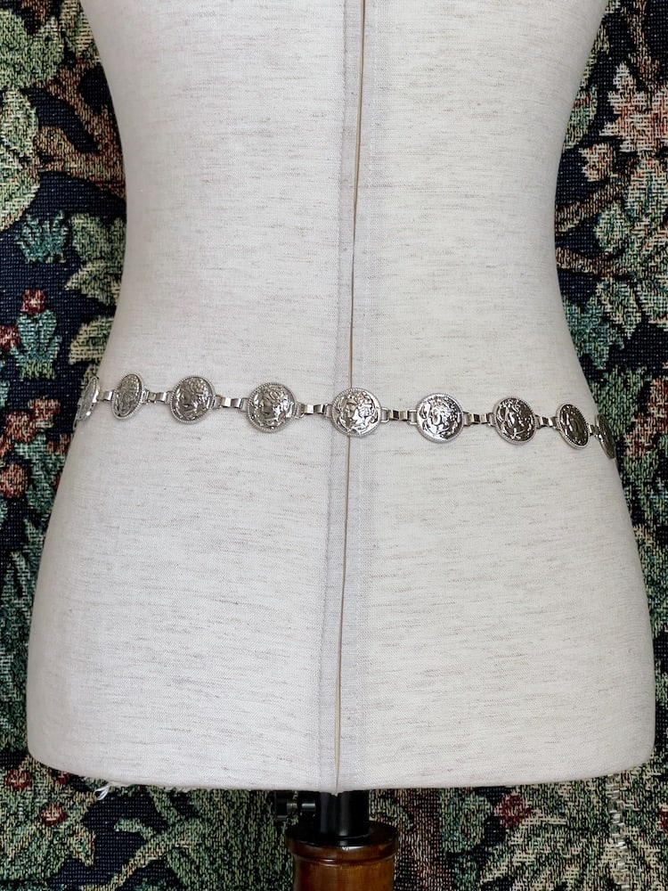 A Historically Inspired Renaissance and Medieval Classical Cameo Coin Belt in Silver pictured on a mannequin.