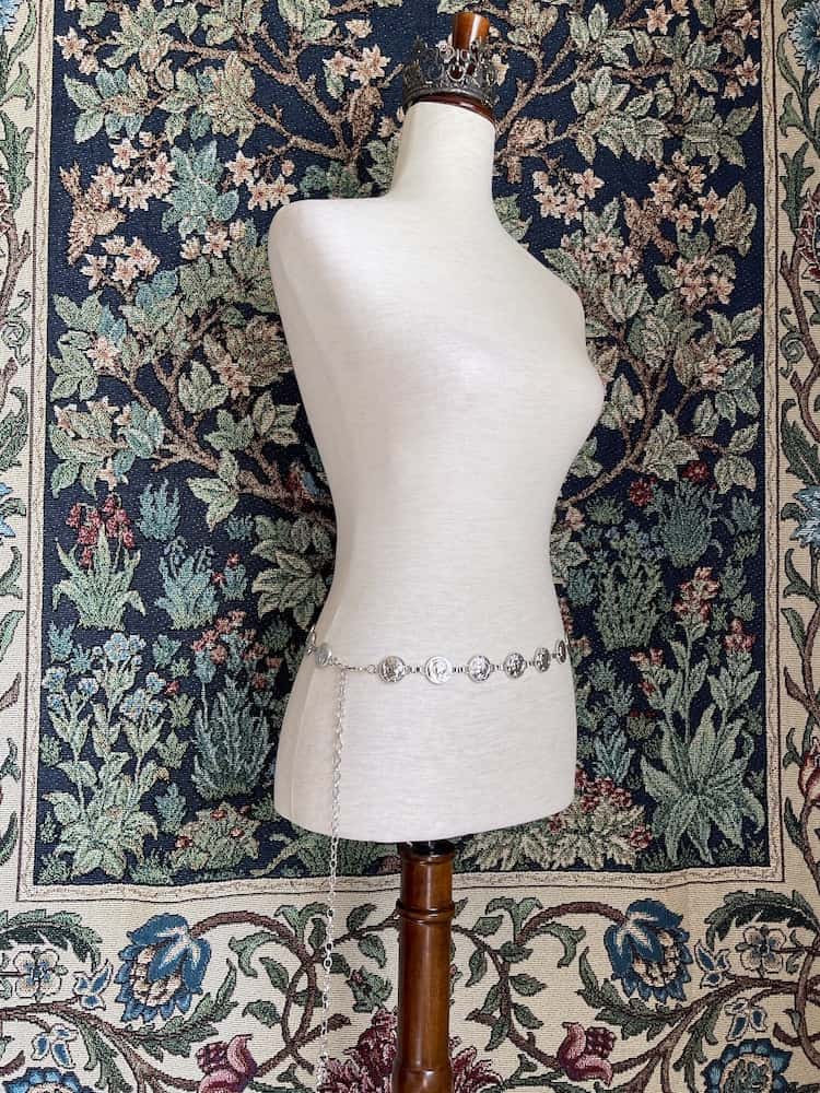 A Historically Inspired Renaissance and Medieval Classical Cameo Coin Belt in Silver pictured on a mannequin.