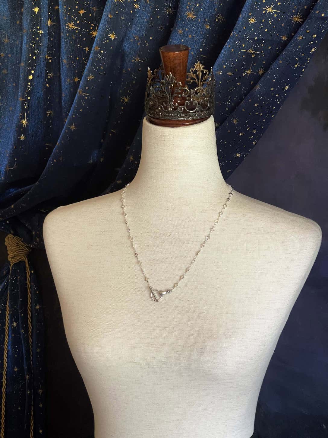 A Handmade Medieval Hand Toggle Clasp Necklace in Silver with Quatrefoil Motif Chain.