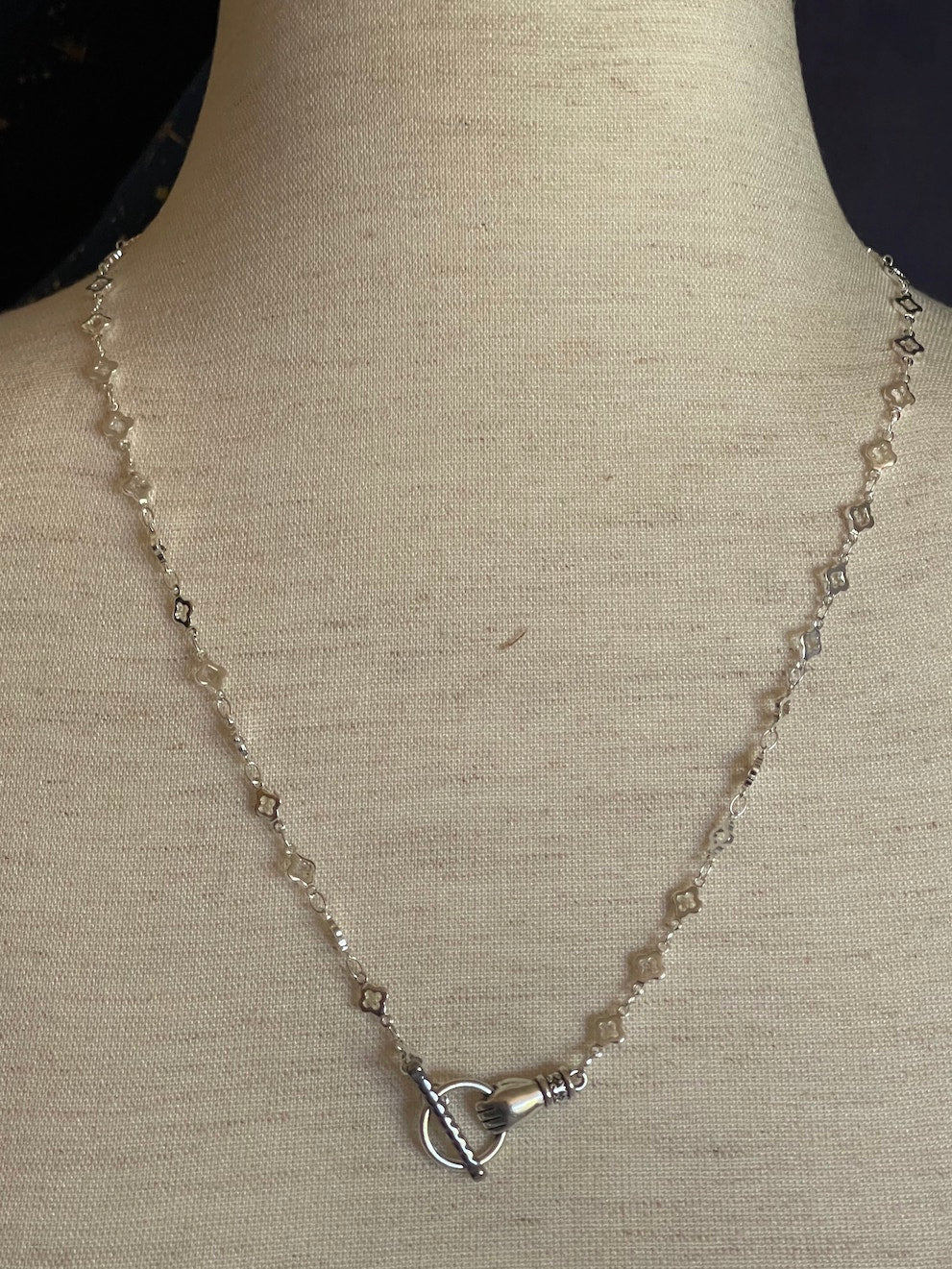 A Handmade Medieval Hand Toggle Clasp Necklace in Silver with Quatrefoil Motif Chain.
