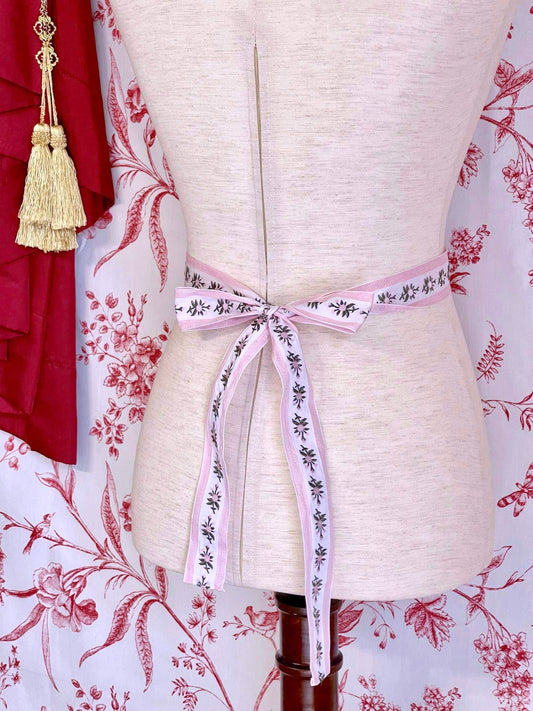 A Handmade Rococo and Regency Style Floral Ribbon Belt in Pink x White inspired by styles from the Rococo, Regency, Victorian, and Edwardian eras.