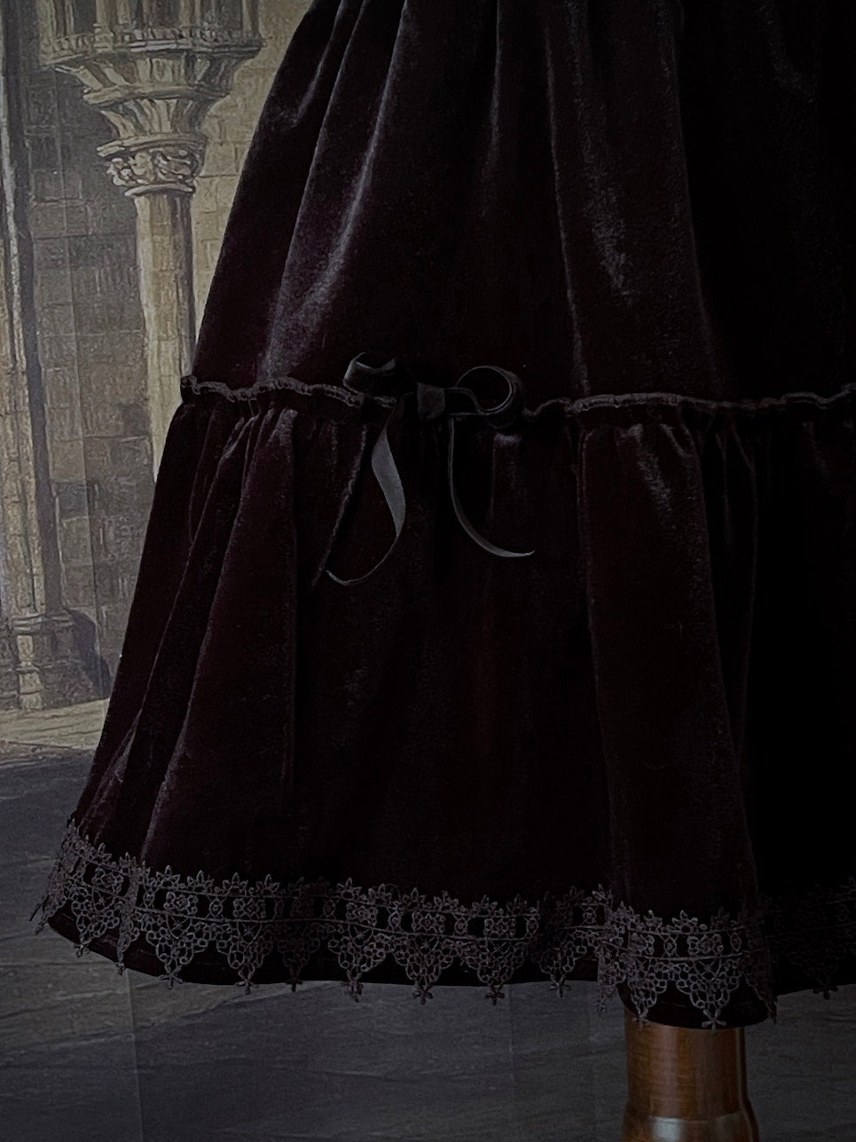 A Historically Inspired Renaissance and Medieval Style Gothic Lace-Trimmed Velvet Mini Skirt in Black with Bow appliques.