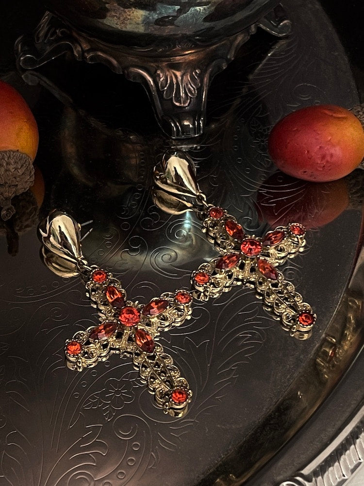 Historically Inspired baroque Ornate filigree Jeweled Cross Earrings in Gold & Red on an autumn display with antique victorian dishes.