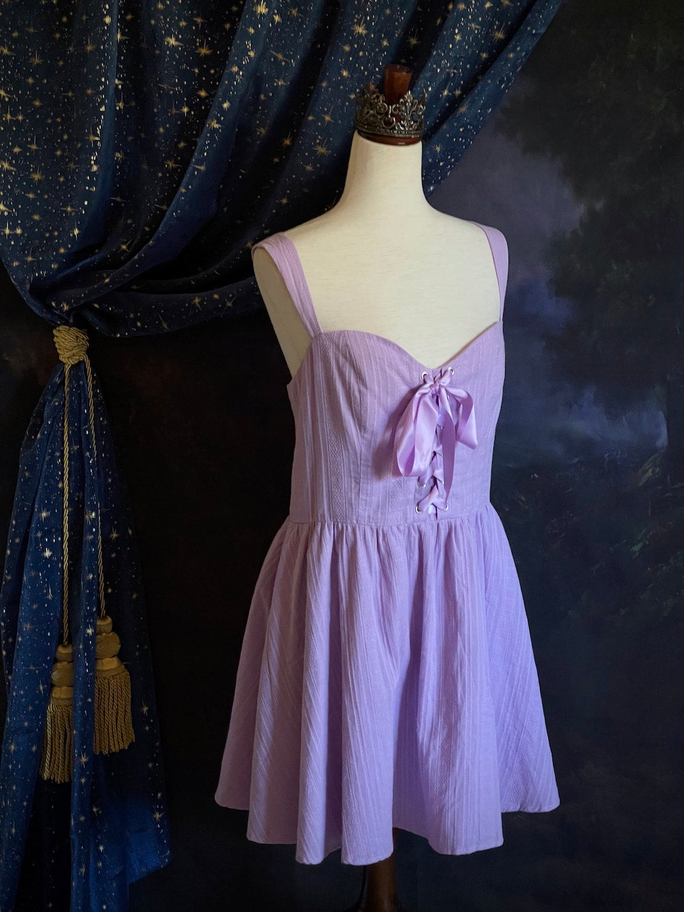 A Medieval Fantasy Corset-Laced Mini Dress in Lavender with Satin Ribbon and Sweetheart Neckline, and Skater Skirt.