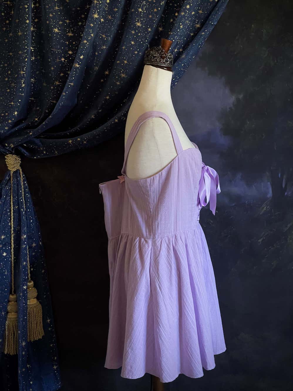 A Medieval Fantasy Corset-Laced Mini Dress in Lavender with Satin Ribbon and Sweetheart Neckline, and Skater Skirt.