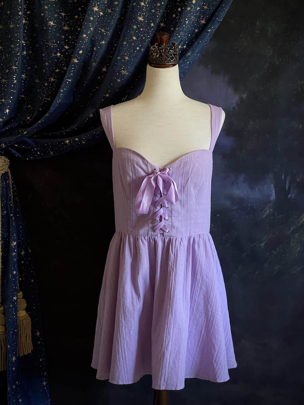 A Medieval Fantasy Corset-Laced Mini Dress in Lavender with Satin Ribbon and Sweetheart Neckline, and Skater Skirt.