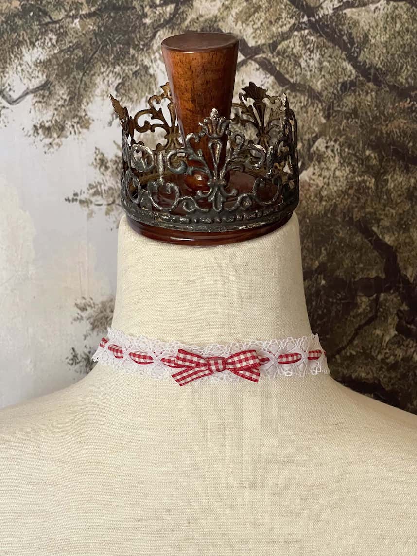 A Vintage style historically inspired cotton lace and gingham ribbon bow choker necklace in white and red.
