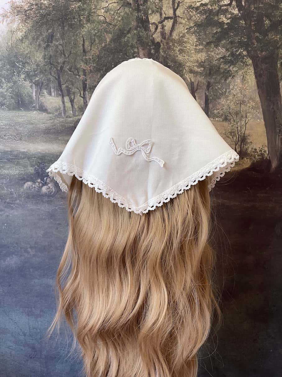Historically inspired cottagecore coquette victorian babushka style triangle headscarf hair accessory with lace trim and bow accessories.