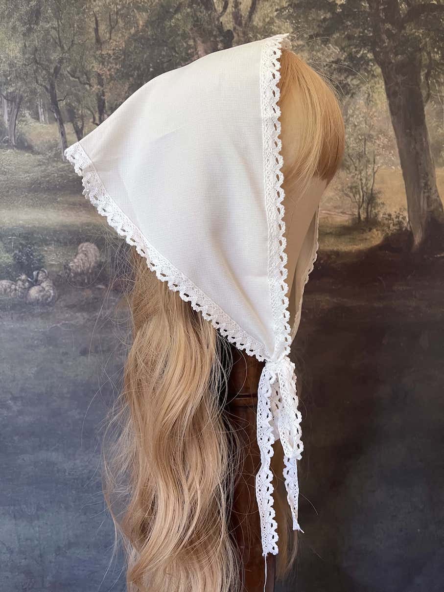 Historically inspired cottagecore coquette victorian babushka style triangle headscarf hair accessory with lace trim and bow accessories.