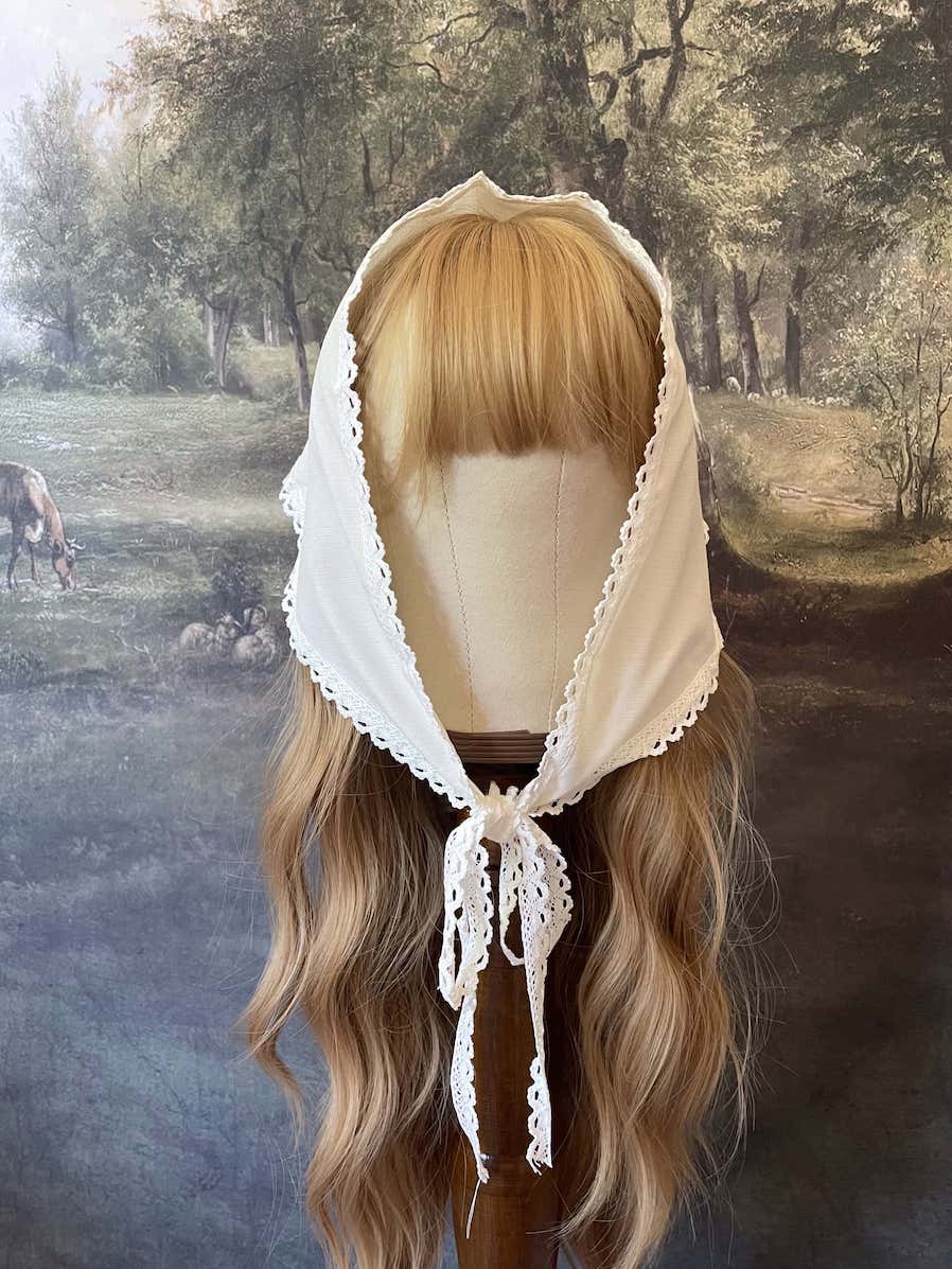 Historically inspired cottagecore coquette victorian babushka style triangle headscarf hair accessory with lace trim and bow accessories.