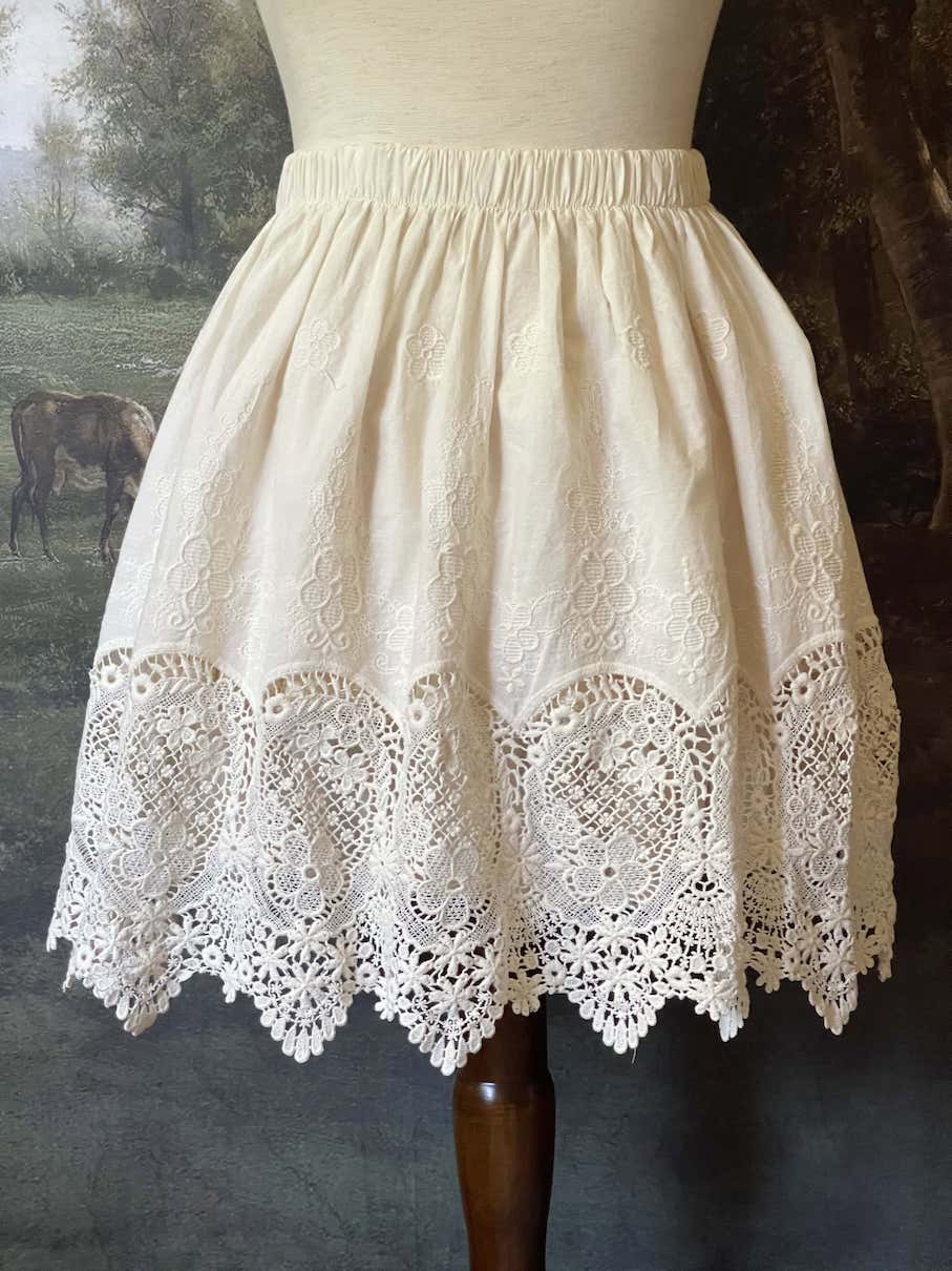 A historical fashion Edwardian & Victorian Inspired Floral Lace-Trimmed Mini Skirt in Ivory.