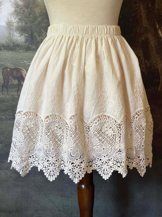 A historical fashion Edwardian & Victorian Inspired Floral Lace-Trimmed Mini Skirt in Ivory.
