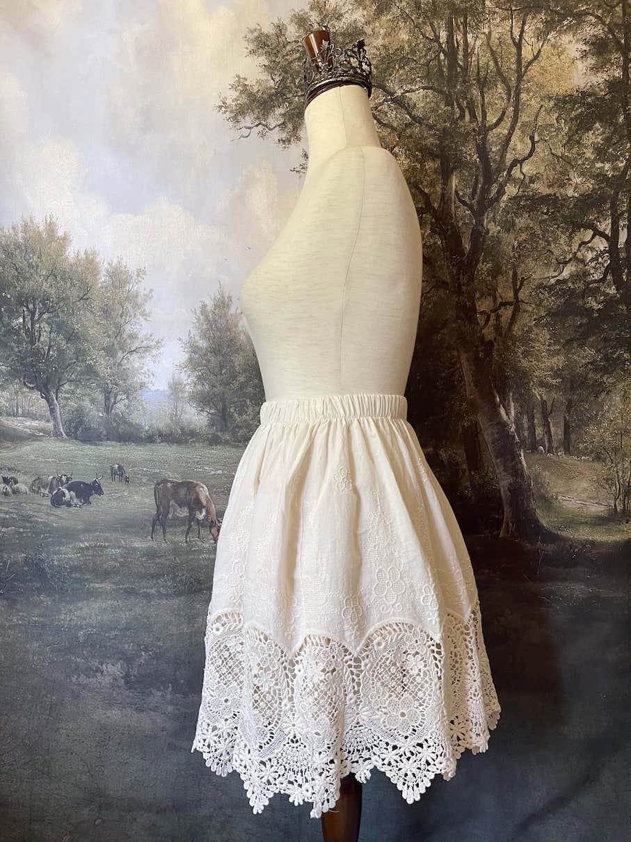 A historical fashion Edwardian & Victorian Inspired Floral Lace-Trimmed Mini Skirt in Ivory.