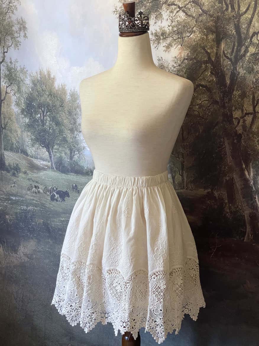 A historical fashion Edwardian & Victorian Inspired Floral Lace-Trimmed Mini Skirt in Ivory.