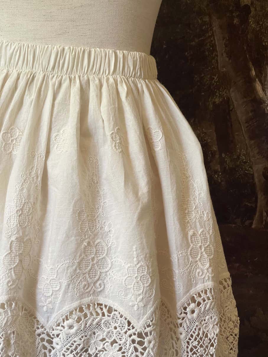 A historical fashion Edwardian & Victorian Inspired Floral Lace-Trimmed Mini Skirt in Ivory.