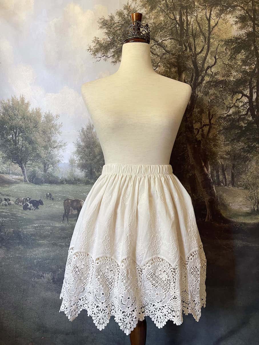A historical fashion Edwardian & Victorian Inspired Floral Lace-Trimmed Mini Skirt in Ivory.