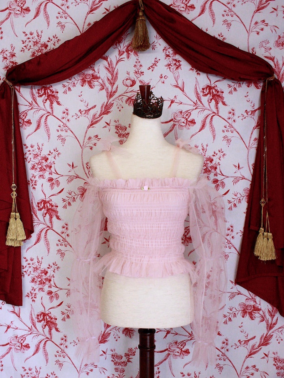 Historically Inspired Victorian Regency and Rococo style ballerina smocked blouse in pastel pink with rosette applique, virago puff sleeves, and off shoulder bow straps.
