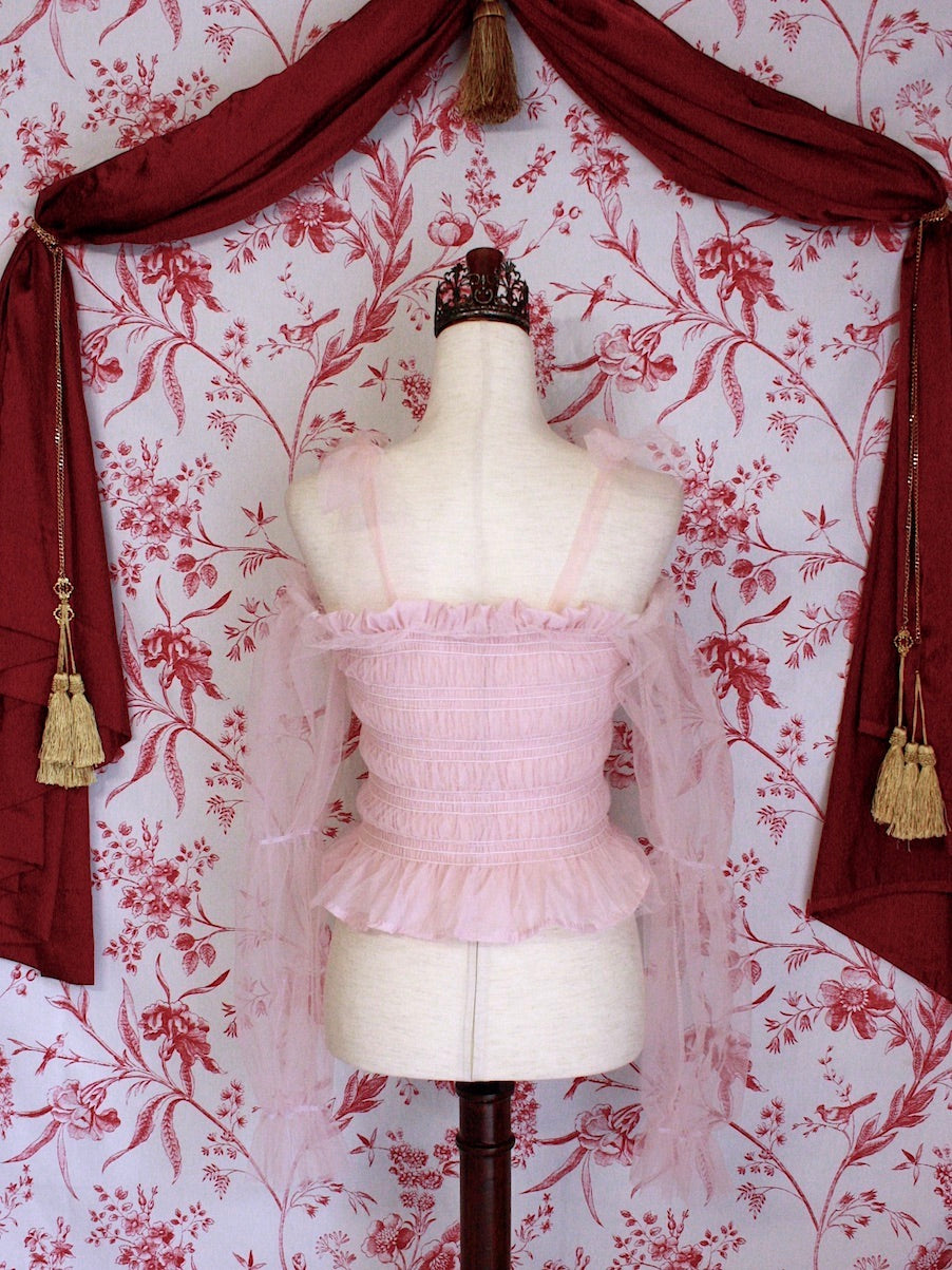Historically Inspired Victorian Regency and Rococo style ballerina smocked blouse in pastel pink with rosette applique, virago puff sleeves, and off shoulder bow straps.