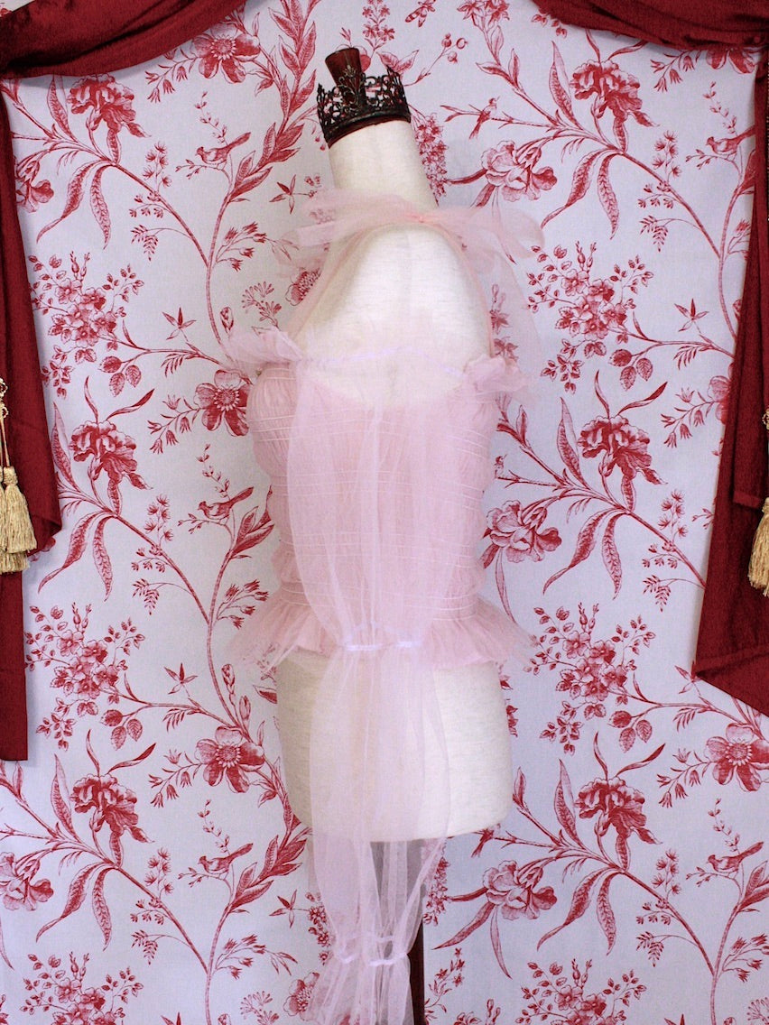 Historically Inspired Victorian Regency and Rococo style ballerina smocked blouse in pastel pink with rosette applique, virago puff sleeves, and off shoulder bow straps.