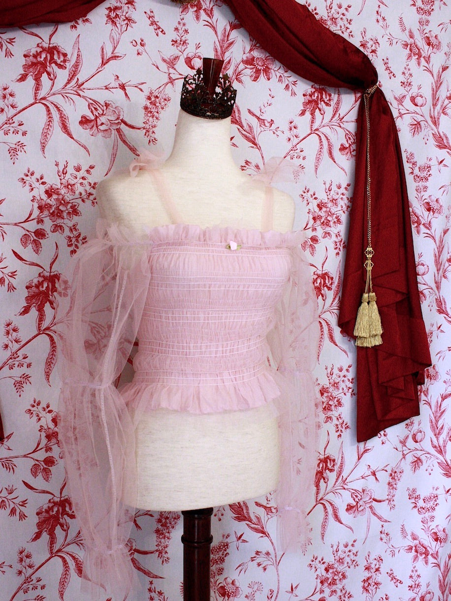 Historically Inspired Victorian Regency and Rococo style ballerina smocked blouse in pastel pink with rosette applique, virago puff sleeves, and off shoulder bow straps.
