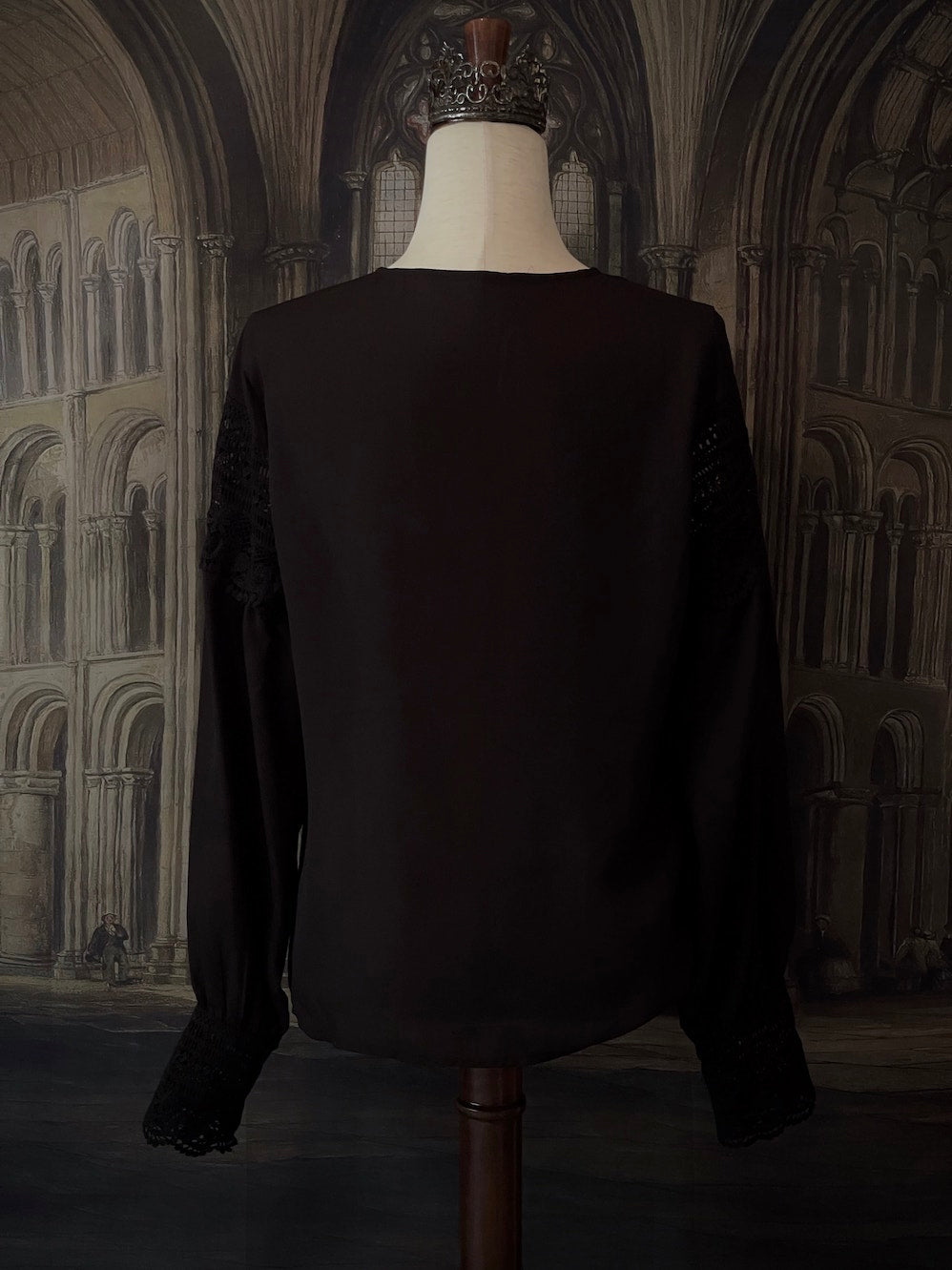 A Victorian Inspired Black Chiffon Crochet Lace Inset Chemise Blouse with Long Bishop Sleeves and Lace cuffs.