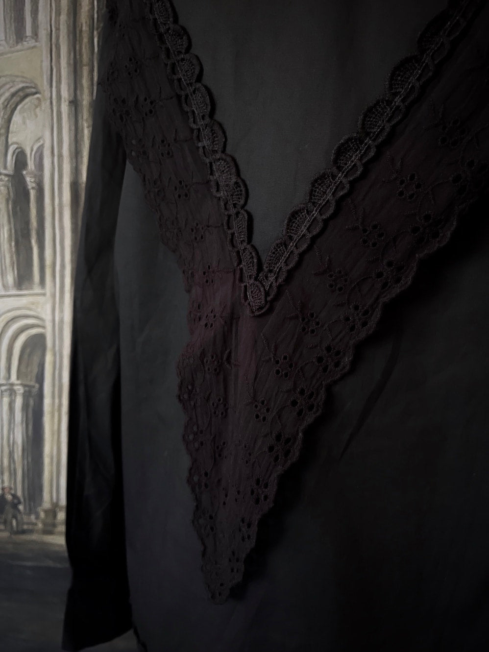 A Historically Inspired Medieval and Victorian Gothic Dagger Collar Blouse in Black Cotton with Lace Trim and Long Sleeves.