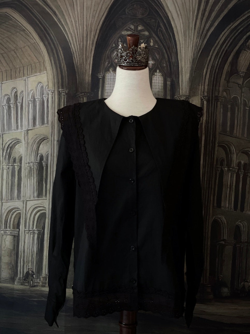 A Historically Inspired Medieval and Victorian Gothic Dagger Collar Blouse in Black Cotton with Lace Trim and Long Sleeves.