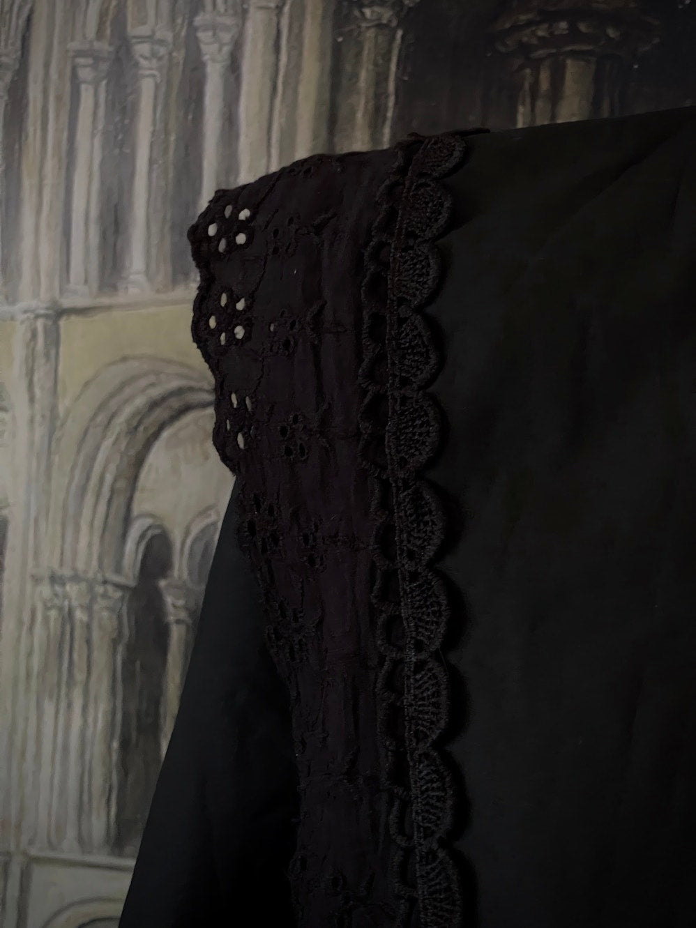 A Historically Inspired Medieval and Victorian Gothic Dagger Collar Blouse in Black Cotton with Lace Trim and Long Sleeves.