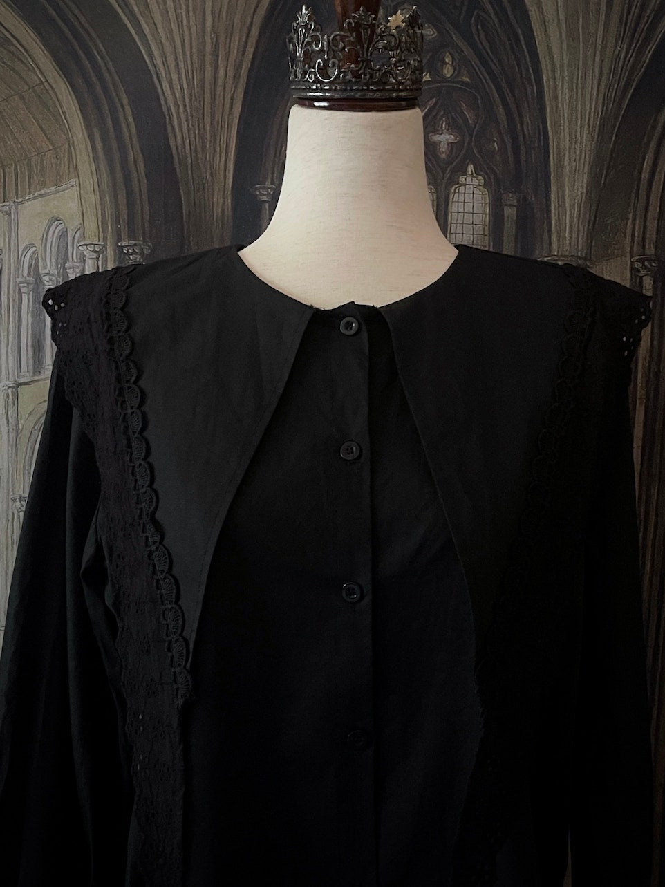 A Historically Inspired Medieval and Victorian Gothic Dagger Collar Blouse in Black Cotton with Lace Trim and Long Sleeves.