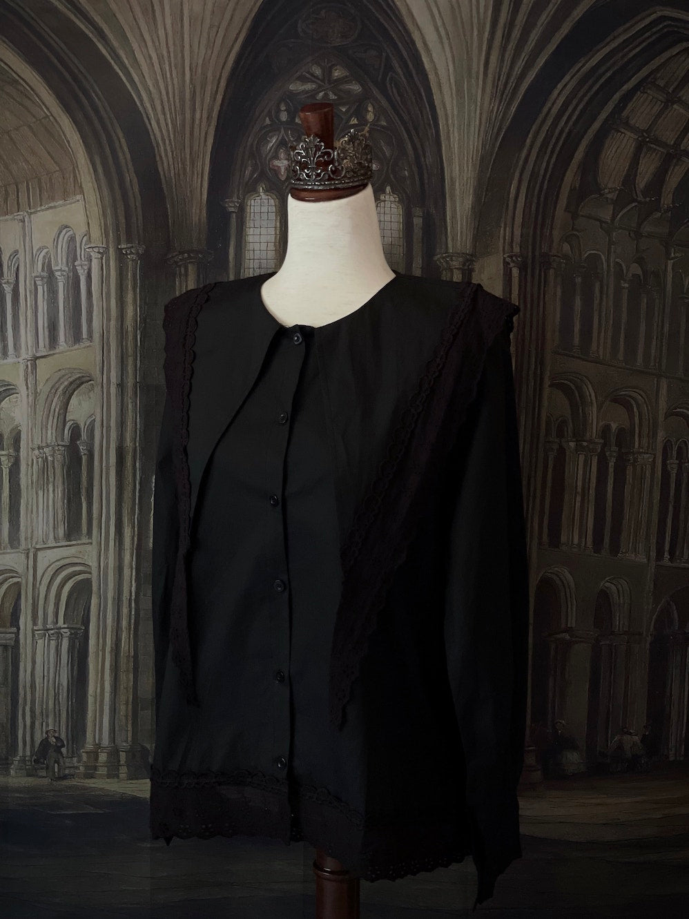 A Historically Inspired Medieval and Victorian Gothic Dagger Collar Blouse in Black Cotton with Lace Trim and Long Sleeves.