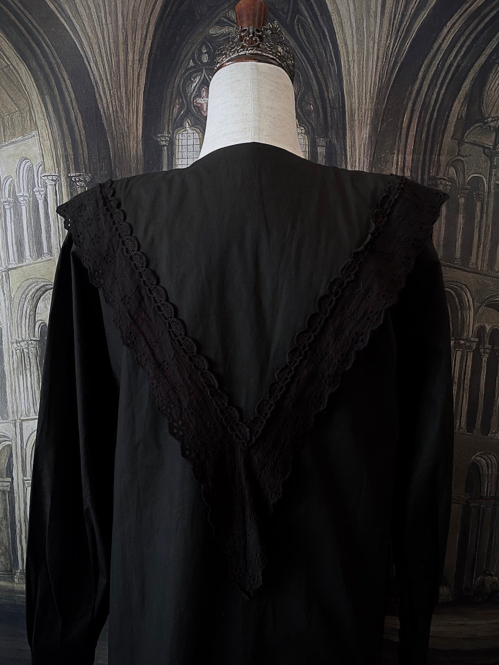 A Historically Inspired Medieval and Victorian Gothic Dagger Collar Blouse in Black Cotton with Lace Trim and Long Sleeves.