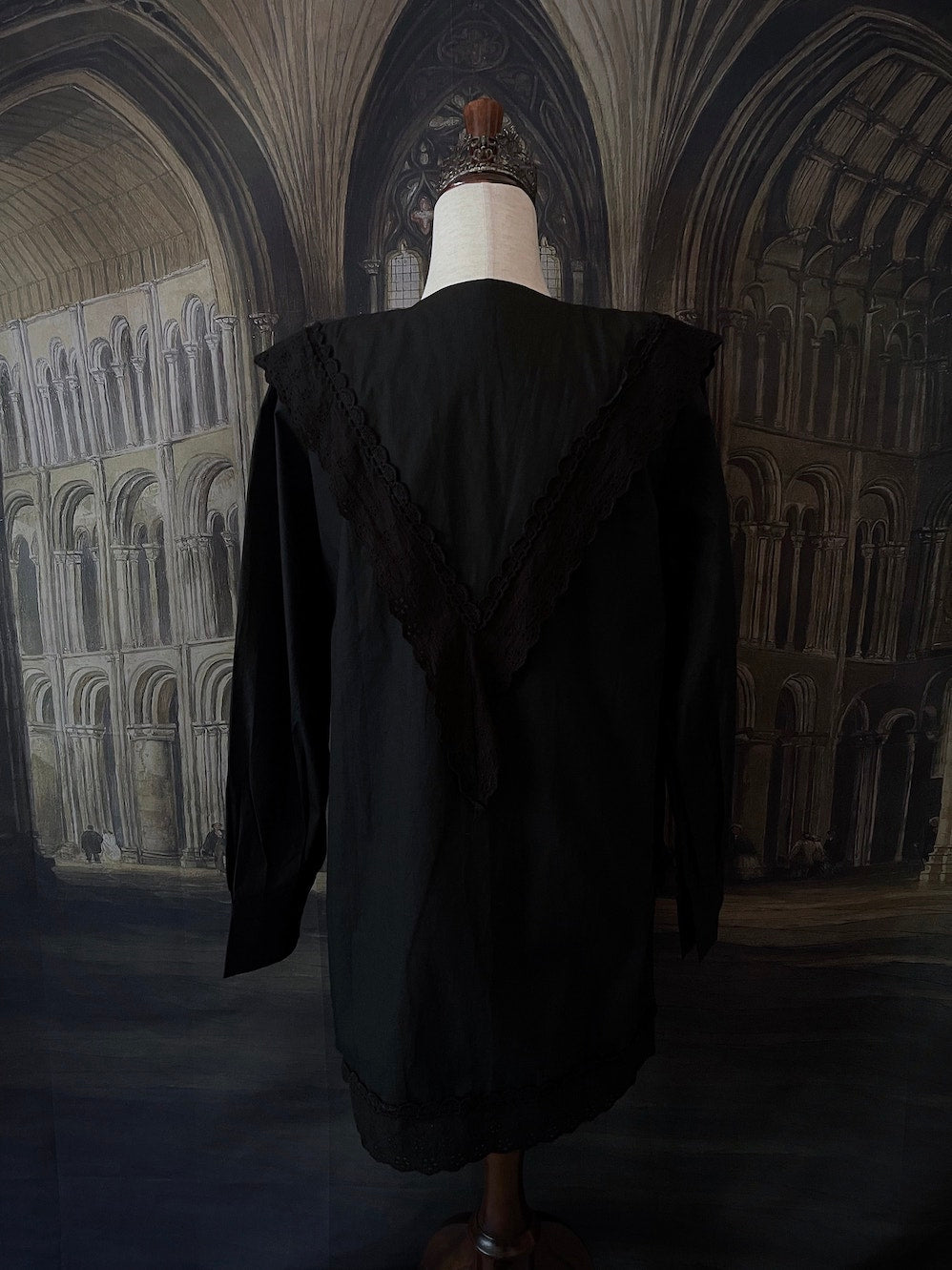 A Historically Inspired Medieval and Victorian Gothic Dagger Collar Tunic Blouse in Black with Lace Trim and Long Sleeves.
